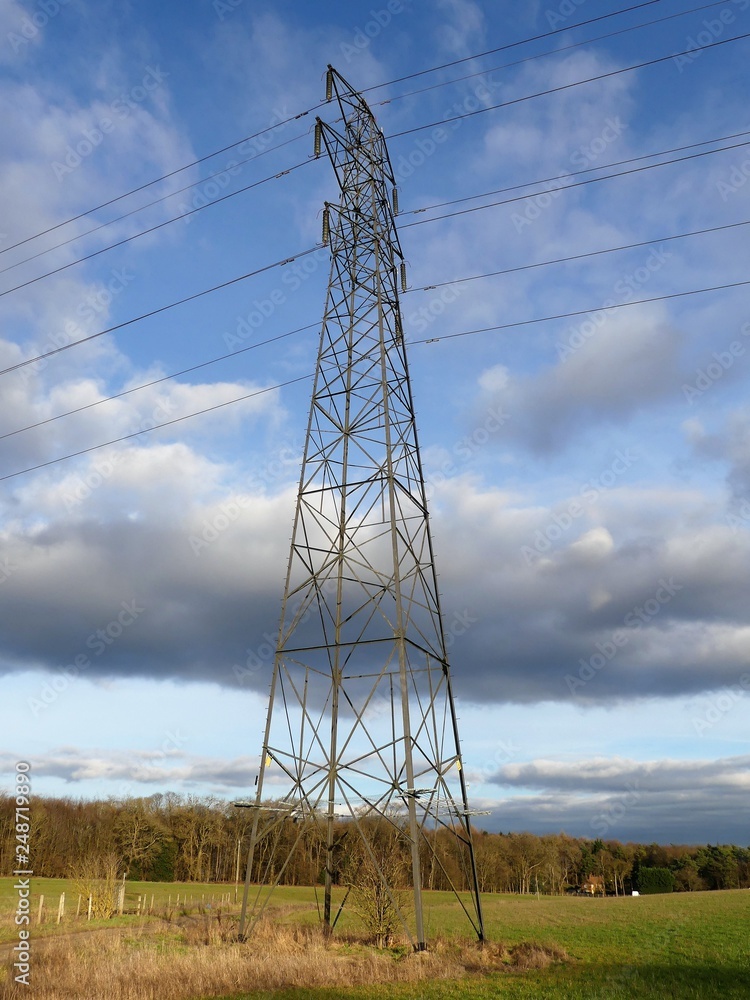 Electricity pylon crossing field in Sarratt, Hertfordshire, UK Electricity pylon crossing field in Sarratt, Hertfordshire, UK