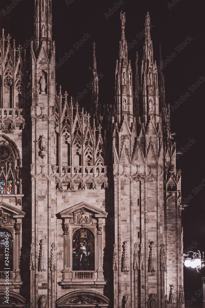 Duomo di Milano (Milan Cathedral) and Piazza del Duomo in Milan, red shadow and dark background, night