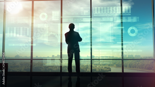 Silhouette of a trader in the office before infographics