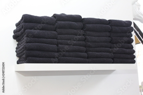 black towels on cupboard in hair salon  photo