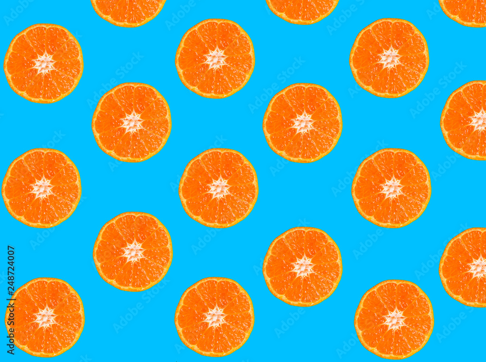 Tangerine slices on blue Tangerine slices on blue