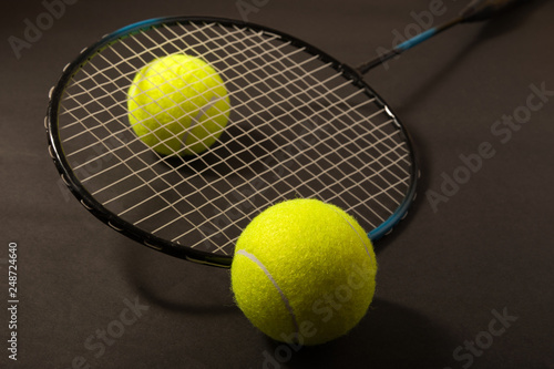 tennis ball and racket © Aleksandr Ugorenkov