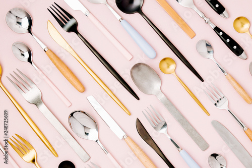 .Collection of various cutlery on pastel background, flat lay, top view,. photo