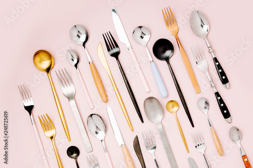 .Collection of various cutlery on pastel background, flat lay, top view,.