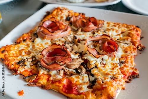 Close up shot of a grill bacon pizza