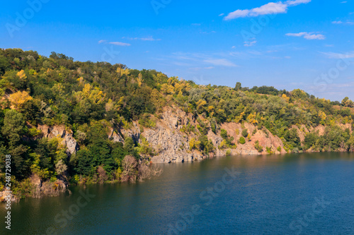 View of the lake at abandoned quarry on summer