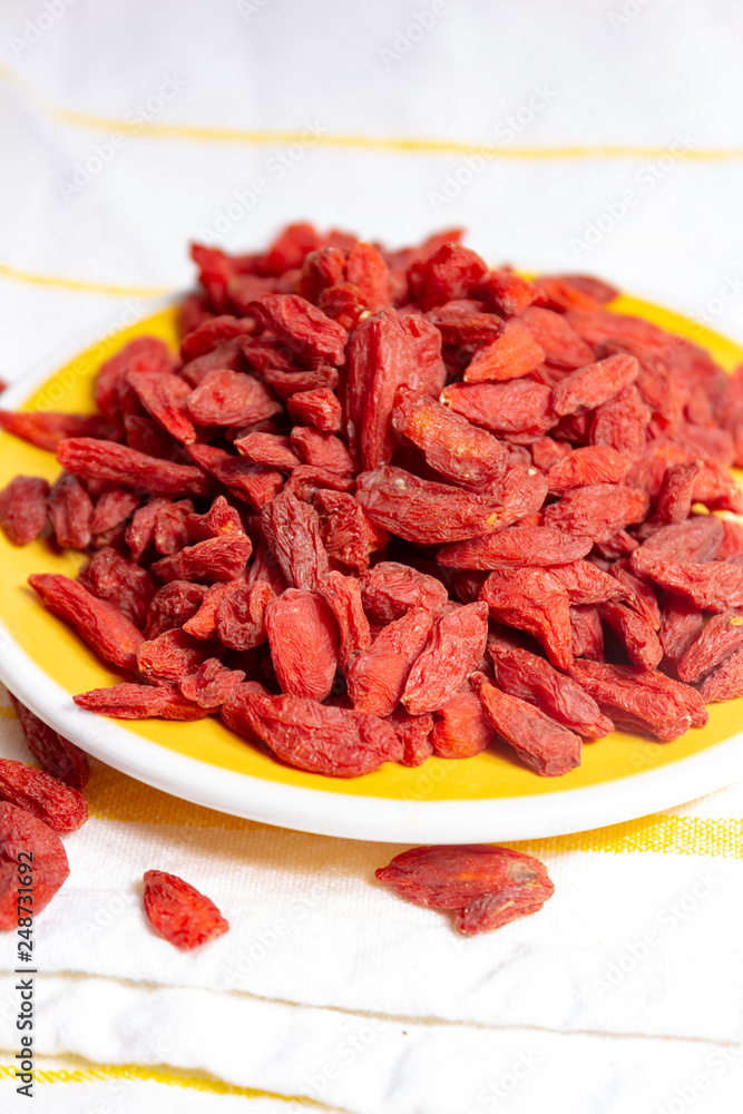 Healthy superfood, red dried goji chinese wolfberry berries, used in many snack foods and supplements, granola bars, yogurt, tea blends, fruit juice as whole berries or ground seeds, seed oil. Healthy superfood, red dried goji chinese wolfberry berries, used in many snack foods and supplements, granola bars, yogurt, tea blends, fruit juice as whole berries or ground seeds, seed oil.