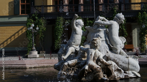 Ancient ornamental statues silhouette fountain in Bad Ischl