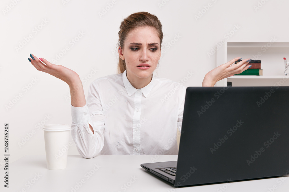 Young attractive woman at modern office desk, working on laptop, massaging temples to forget about constant headaches, noisy loud office giving a migraine, relieving stress, chronic pain, help soothe Young attractive woman at modern office desk, working on laptop, massaging temples to forget about constant headaches, noisy loud office giving a migraine, relieving stress, chronic pain, help soothe