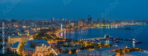 Beautiful business night view of Baku downtown  wide panoramic photograph
