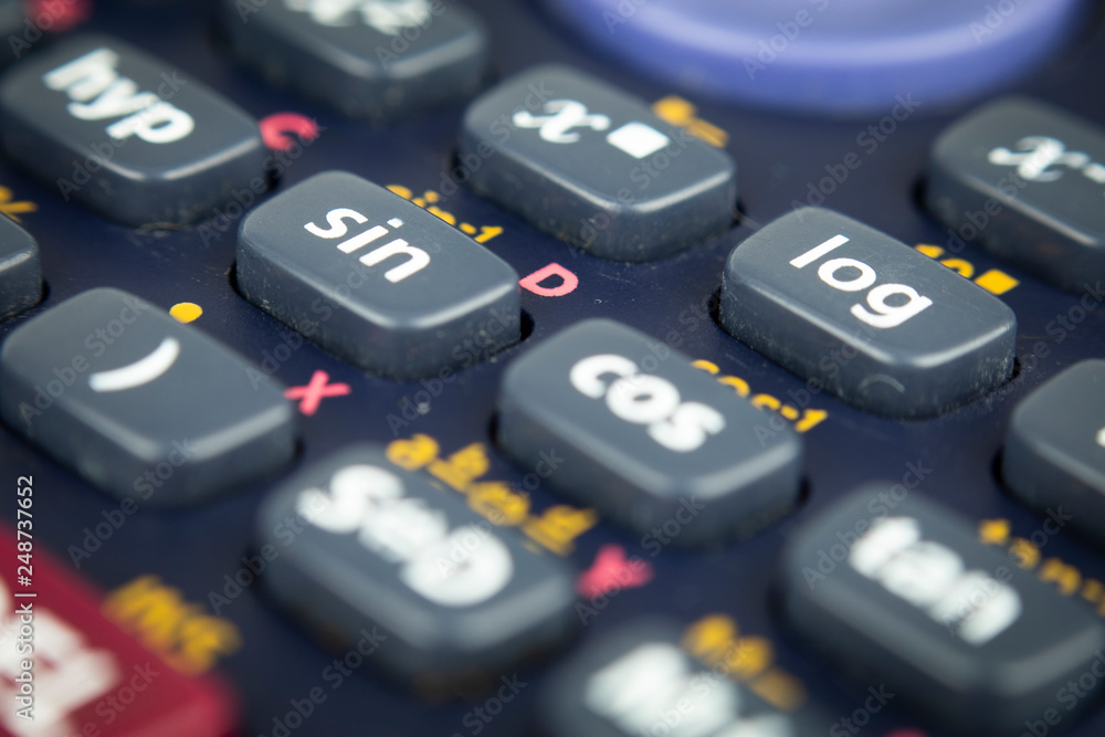 Closeup or macro photo of the scientific calculator buttons. Keys include the mathematical terms. Numerical operation concept. Closeup or macro photo of the scientific calculator buttons. Keys include the mathematical terms. Numerical operation concept.
