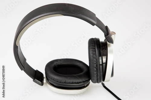 audio black headphones dj in white studio background