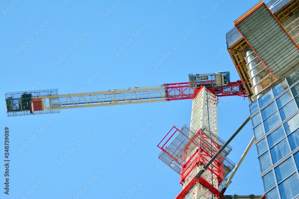 Naklejka premium Crane attached to building