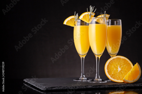 Mimosa cocktails in champagne glasses