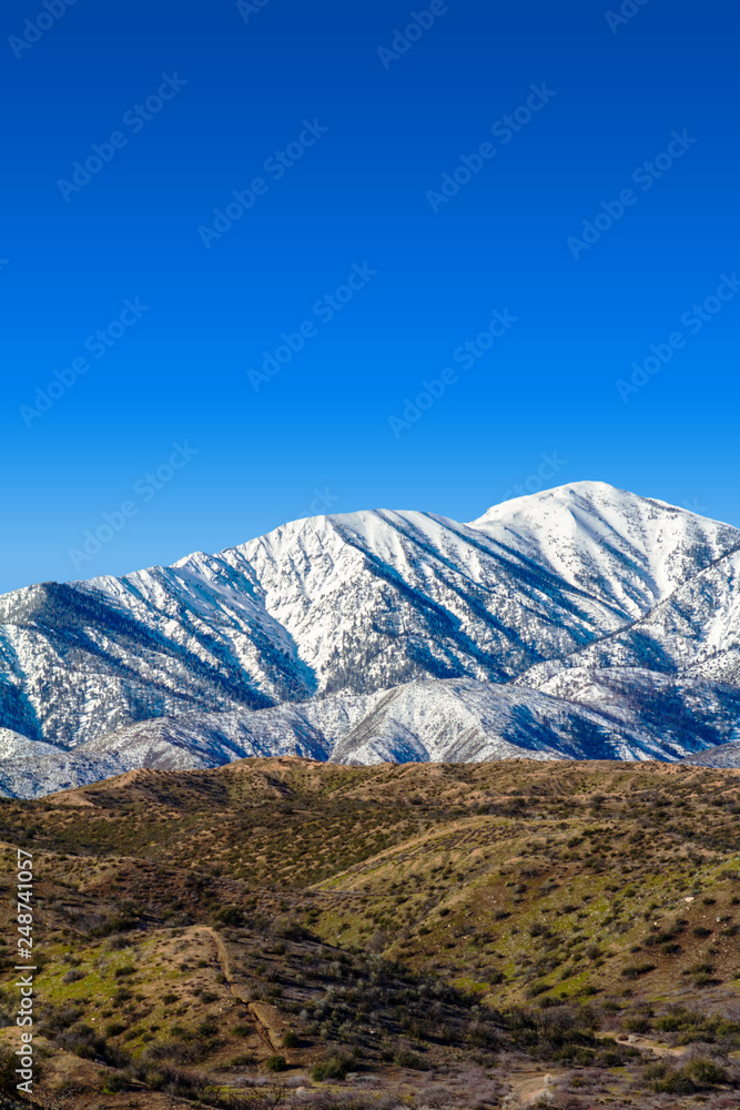 Vertical image of the snow covered San Gabriel Mountains in the Angeles National Forest in Southern California Vertical image of the snow covered San Gabriel Mountains in the Angeles National Forest in Southern California