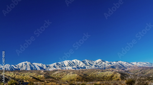 Panoramic view of the north side of the San Gabriel Mounatins in Southerm California, taken from the Mojave Desert. photo