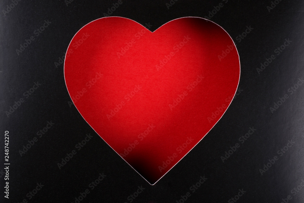 Red heart on black background with space for text, for desig. Paper cardboard Red heart on black background with space for text, for desig. Paper cardboard