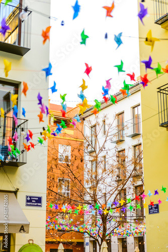 Decoration in the colorful square of the market of the Tapineria, center of the city of Valencia, where the tourists stop to rest and taste the typical Mediterranean meals, seen from below. © Joaquin Corbalan