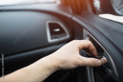 Close-up, hand of man open car door from inside.