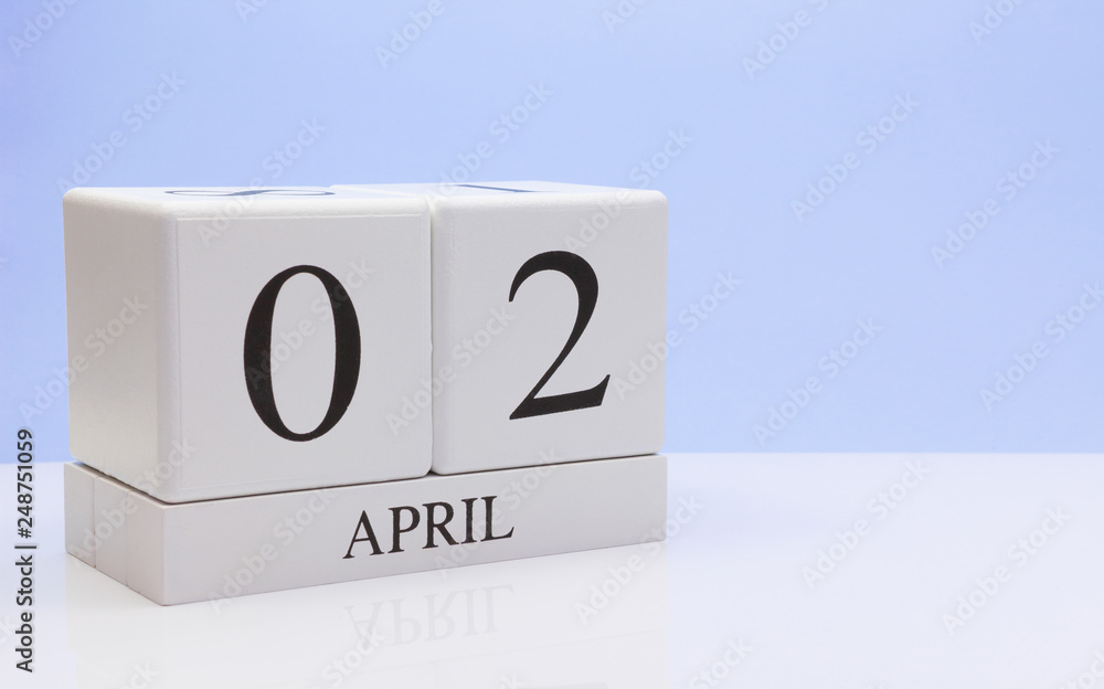 April 02st. Day 02 of month, daily calendar on white table with reflection, with light blue background. Spring time, empty space for text April 02st. Day 02 of month, daily calendar on white table with reflection, with light blue background. Spring time, empty space for text