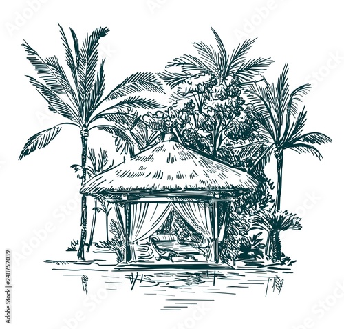 gazebo with thatched roofs among the palm trees