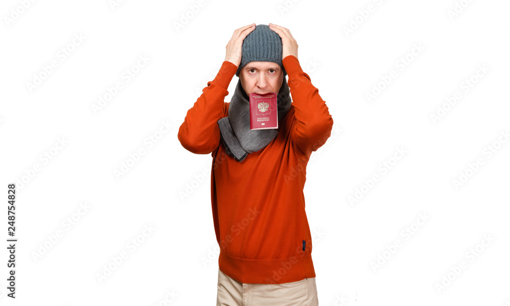 The Caucasian man with the international passport of the Russian Federation in warm clothes clutched hands at the head The Caucasian man with the international passport of the Russian Federation in warm clothes clutched hands at the head
