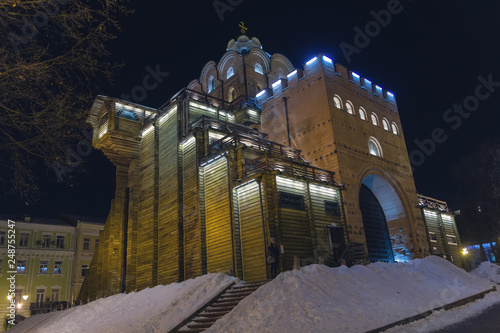 Illuminated Golden Gates at winter night. Kiev, Ukraine photo