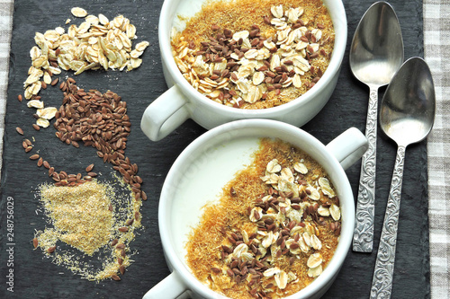 Healthy breakfast with white yogurt or kefir with flax seeds, oatmeal and bran. Superfood Fermented dairy products