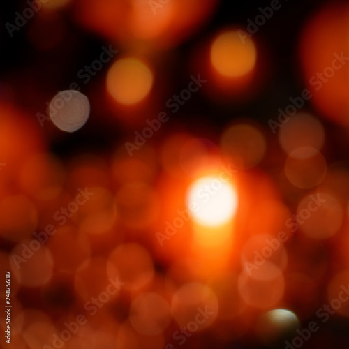 Red background blurred light christmas holiday pattern. Abstract decoration bokeh gllitter xmas and new year or valentine festive.