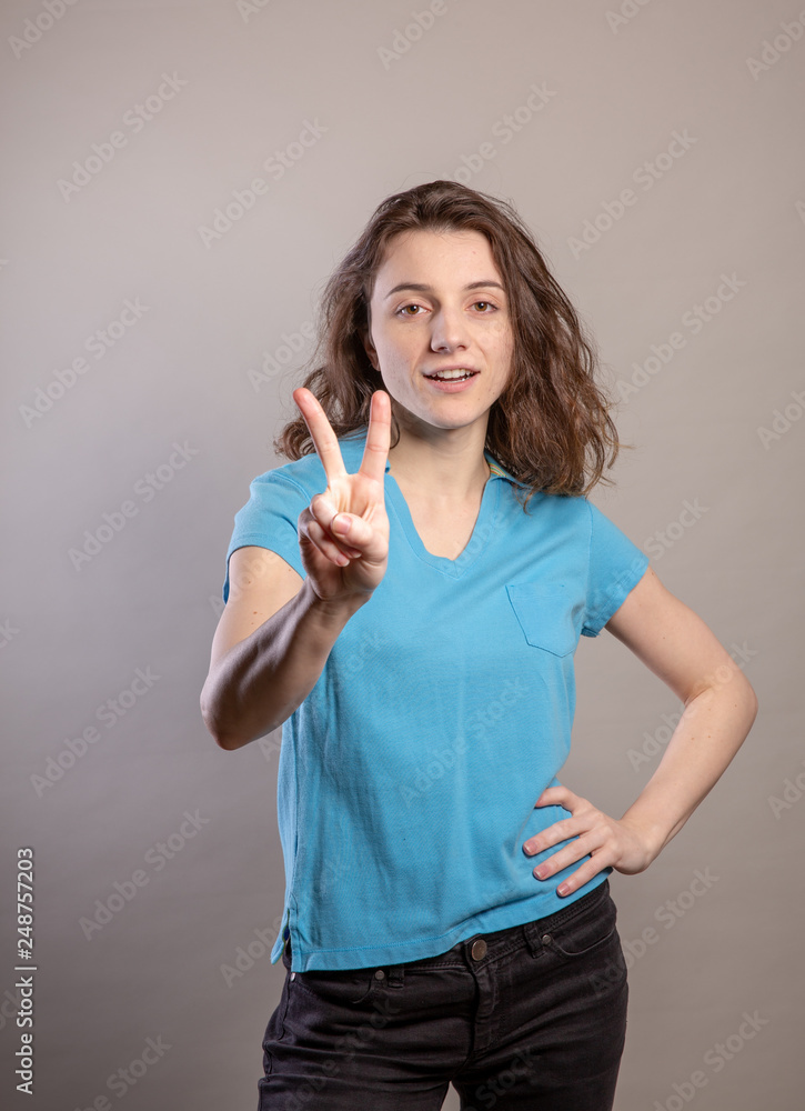 Woman in Blue Shirt Gesturing Woman in Blue Shirt Gesturing