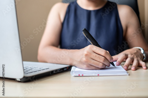 Businesswoman using laptop analysis marketing plan. Business, Finance concepts