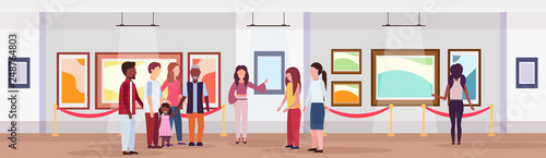 guide lady and mix race tourists group in modern art gallery museum interior looking creative contemporary paintings artworks or exhibits flat horizontal banner full length