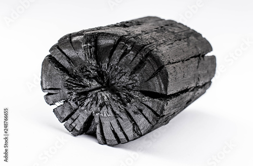 Black charcoal isolated on white background.
