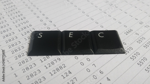 sec. etf. computer keys of exchange trade funds on a background with numbers. bitcoin. blockchain. cryptocurrency