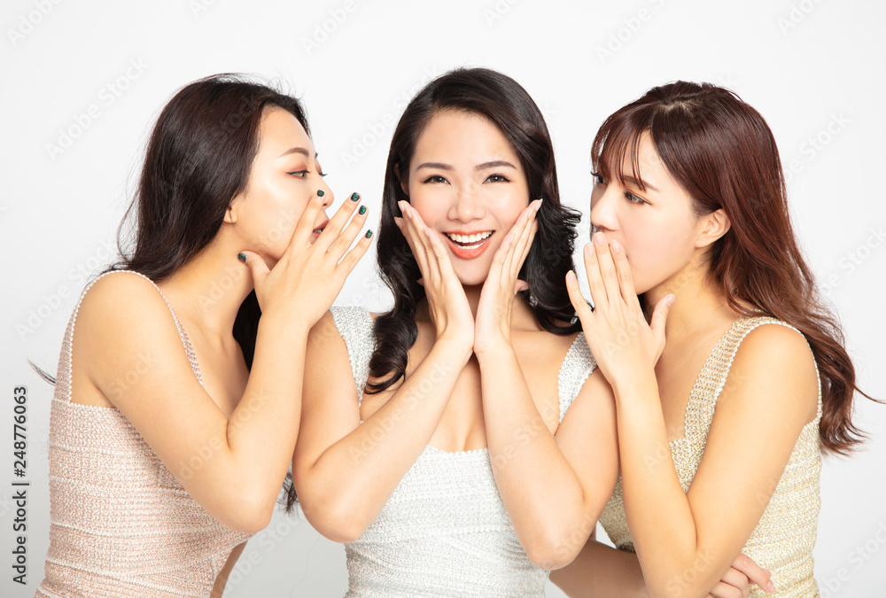 Three women telling whispering and secret gossip Three women telling whispering and secret gossip