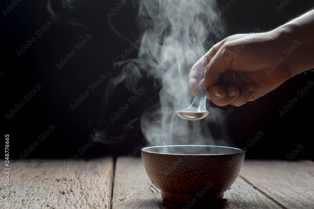 Hot soup is placed on the black backing table. Hot soup is placed on the black backing table.