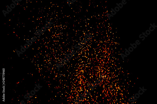 Abstract blurred blaze fire flames. Fire flames with sparks on a black background