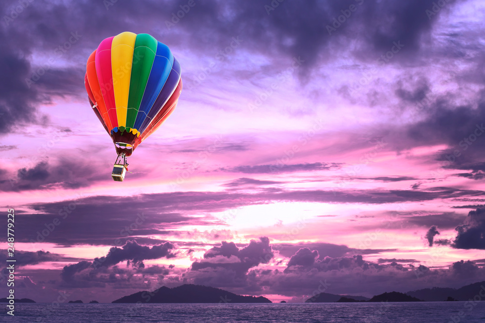 Fototapeta premium Hot air balloons over the ocean at sunset with dramatic sky. Honolulu Hawaii
