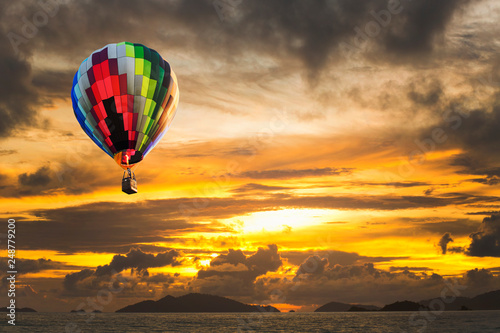 Hot air balloons over the ocean at sunset with dramatic sky. Honolulu Hawaii © littlestocker