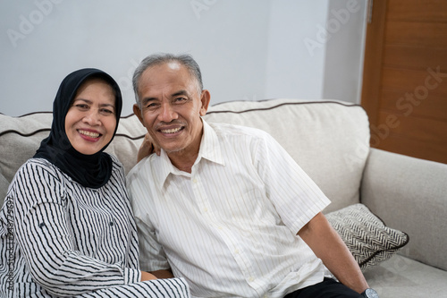 portrait of young asian muslim eldery couple together smiling to camera © Odua Images