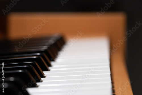 Piano keys of a light brown piano