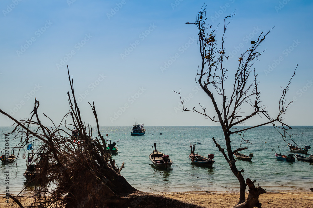 Beautiful view of fisherman boats moored on the beach of fisherman village at Naiyang beach, Phuket, Thailand. Beautiful view of fisherman boats moored on the beach of fisherman village at Naiyang beach, Phuket, Thailand.