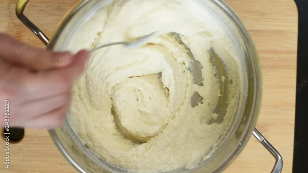 Preparation of the dough for manna pie, cake. Pour, pour, stir ingredients in stainless steel pan. For further baking in molds in the oven Preparation of the dough for manna pie, cake. Pour, pour, stir ingredients in stainless steel pan. For further baking in molds in the oven