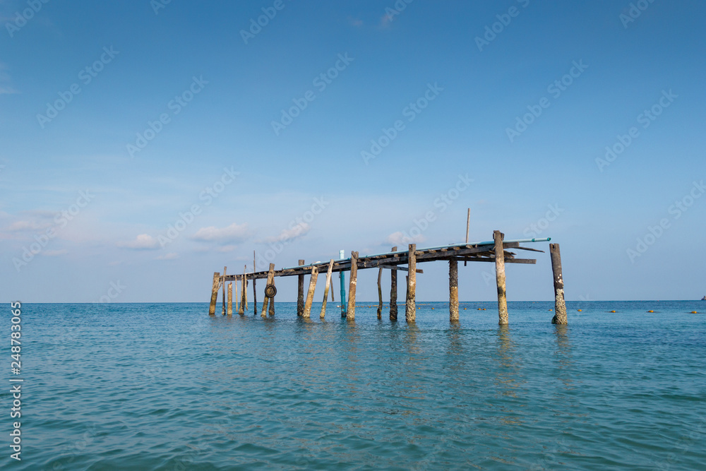 Wooen jetty was abandoned. Located by the beach Stretching into the sea.