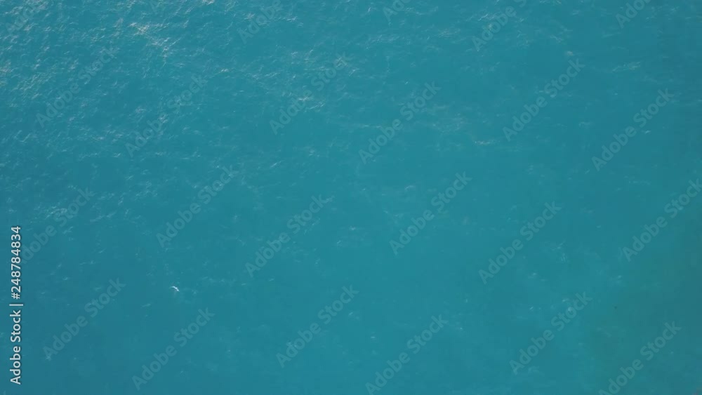 Aerial: Sea surface view with sun reflection at center,,static video Aerial: Sea surface view with sun reflection at center,,static video
