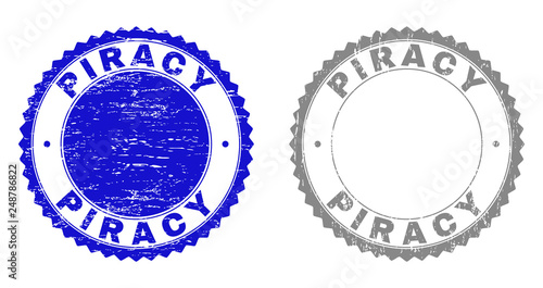 Grunge PIRACY stamp seals isolated on a white background. Rosette seals with grunge texture in blue and gray colors. Vector rubber stamp imitation of PIRACY label inside round rosette.