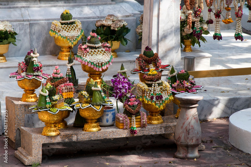 Bangkok Thailand, outdoor alter with offerings at Wat Ratchabophit