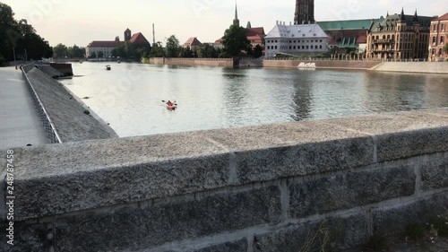 Panorama of Wroc?aw. River Odra flowing through the old city. People canoeing on the river. photo