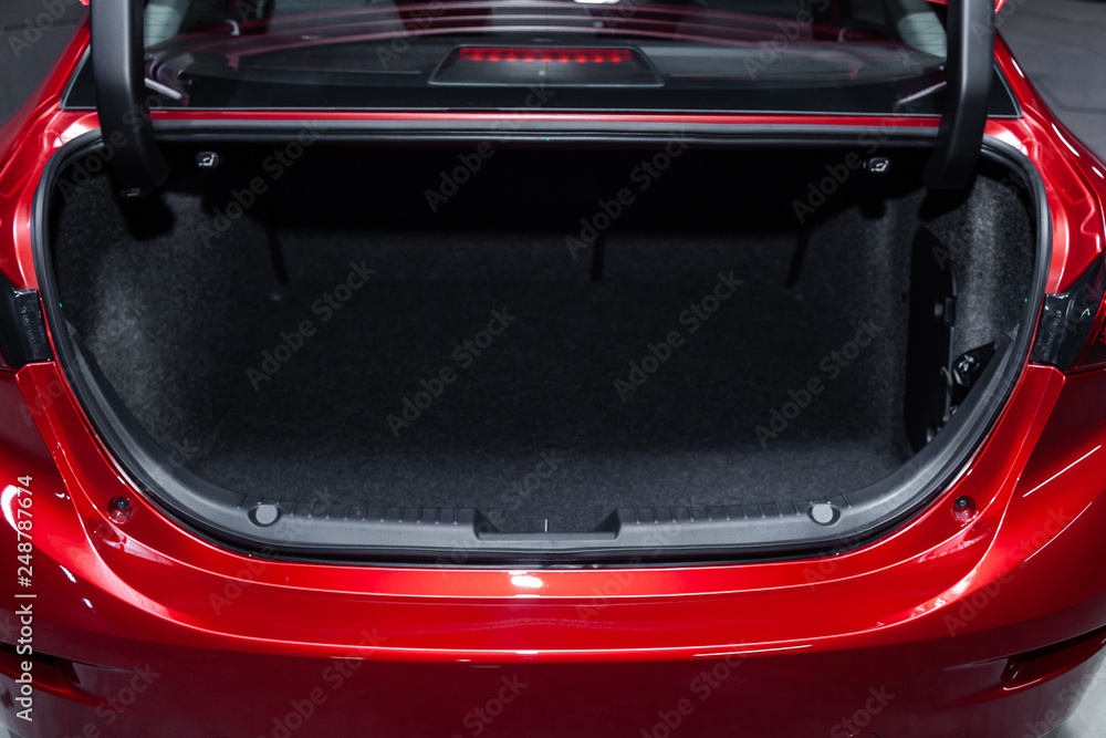 Сlose-up of the car  black interior:   clean luggage boot and car trunk,  front view.