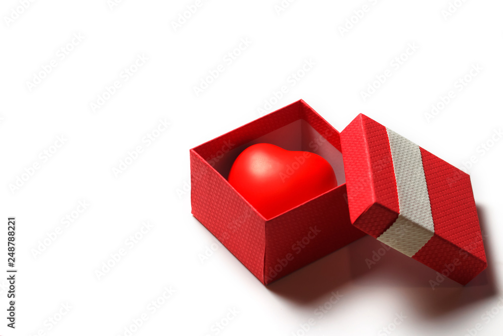 Red gift box with toy Valentine's red heart inside. Love concept. Love you. Just for you.